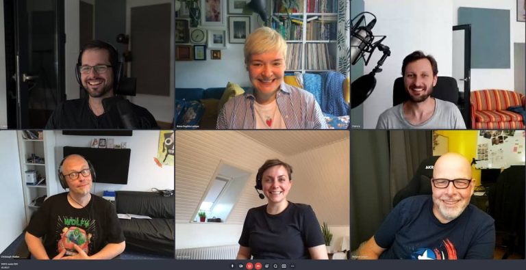 Six people laughing into the camera while of an online meeting